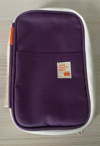 travel organizer wallet in purple with multiple card slots and mesh pockets