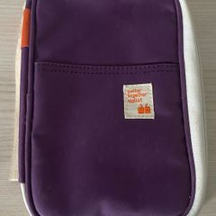 travel organizer wallet in purple with multiple card slots and mesh pockets