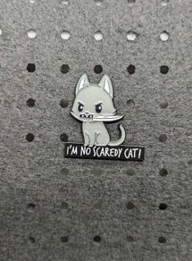 Cat with knife enamel pin