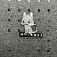 Cat with knife enamel pin
