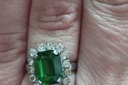 Beautiful silver tone ring with green stone.
