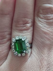Beautiful silver tone ring with green stone.