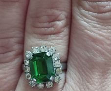 Beautiful silver tone ring with green stone.
