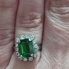 Beautiful silver tone ring with green stone.
