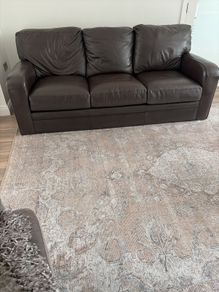 2 Italian Brown leather sofas and footstools