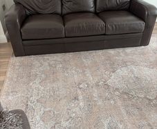 2 Italian Brown leather sofas and footstools