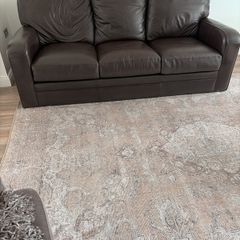 2 Italian Brown leather sofas and footstools