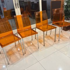 Four striking chrome and plastic orange vintage Italian dining chairs. Very decent and useable condition. A bargain at this price.