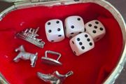 Monopoly dice and game pieces
