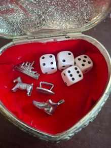 Monopoly dice and game pieces
