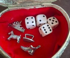Monopoly dice and game pieces