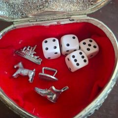 Monopoly dice and game pieces