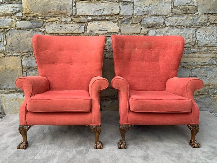 A pair of Chippendale Revival Country House wingback armchairs on Ball & Claw feet.