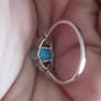 Ring made of 925 silver with oval opal of blue shade and cubic zirconia. Image 2