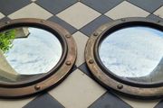 Antique pair of brass convex mirrors