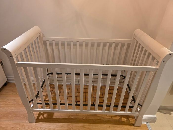 sleigh-style  baby crib and changing table