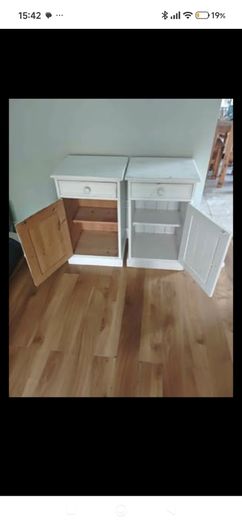 Matching pair of solid wood bedside lockers / cabinets.