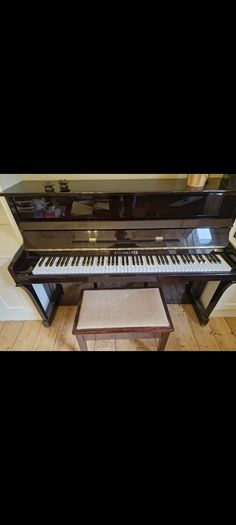 Steinmayer upright piano and stool perfect condition