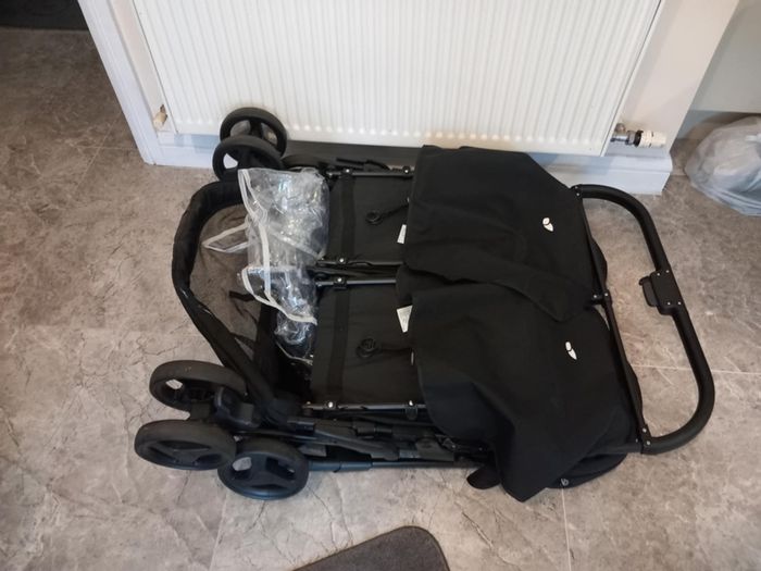 Joie double baby's buggie with rain covers
