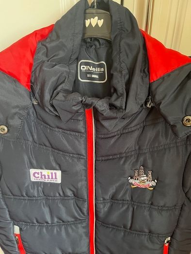 O'Neills CORK GAA Padded Puffer Gilet  jacket Navy. CORCAIGH. Detachable hood.  Size small adult. In Excellent condition