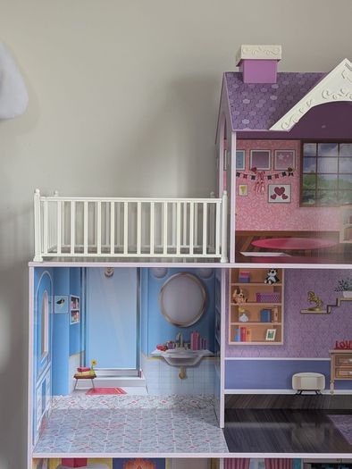 Large wooden dolls house with furniture