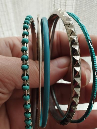 Charming bracelets in silver and blue tones.