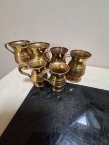 Vintage brass measuring jugs