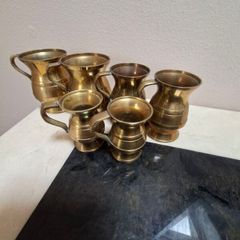 Vintage brass measuring jugs