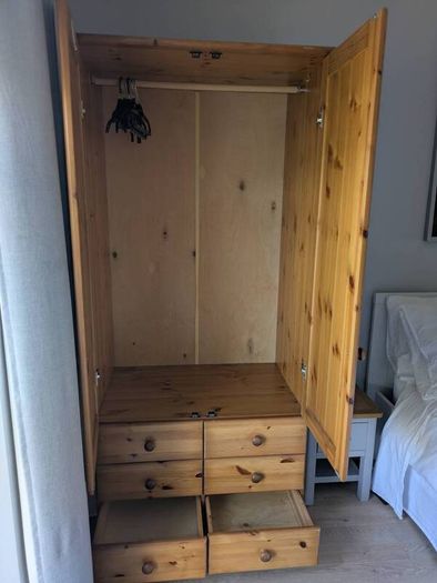 solid pine wardrobe with drawers.