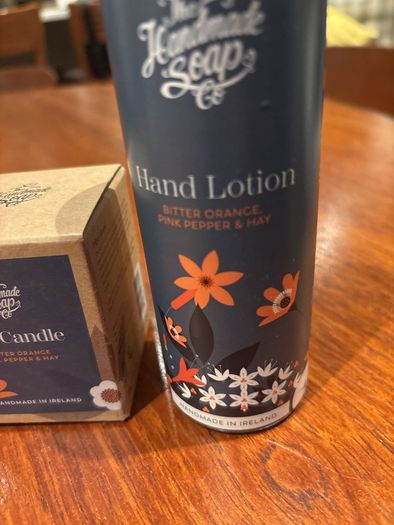 The Handmade Soap Company Hand Lotion ( bitter orange, pink pepper and hay ) and matching candle 70 grams