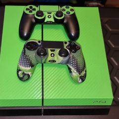 Playstation 4 with two controllers