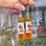 Mini Spiced Rum Bottle Drop Earrings. Image 5