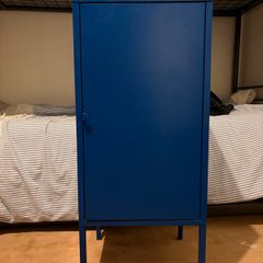 Two blue metal beside lockers