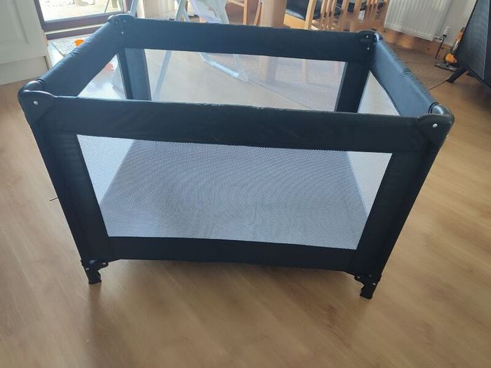Black travel cot