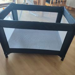 Black travel cot