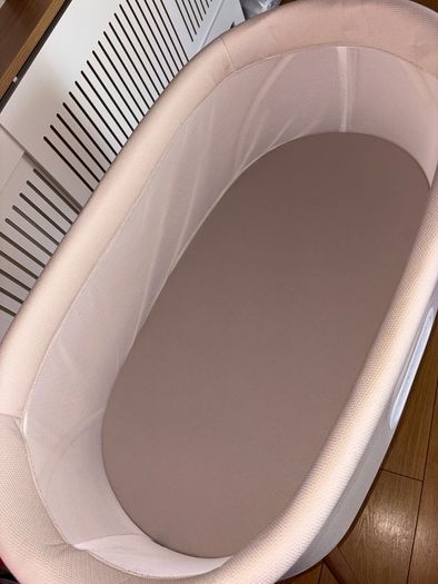 Nested motion electric bedside crib