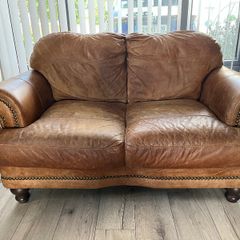 Two seater tan leather sofa