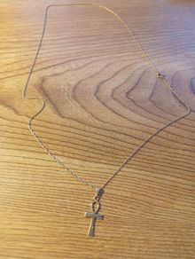 gold chain and cross