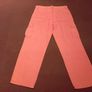Orange cargo trousers. Image 7