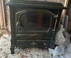 Oil stove with back boiler