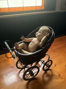 pram and baby doll
