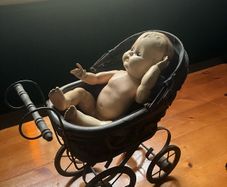 pram and baby doll