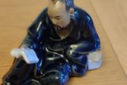 Vintage Figurine man reading book