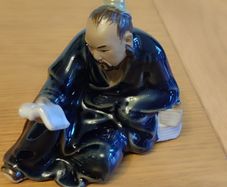 Vintage Figurine man reading book