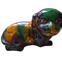 Chinese Antique 'egg and spinach'-glazed biscuit porcelain figure of a Dog Kangxi