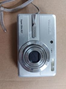 Super Slim X57 Traveler Digital Camera, in excellent condition, unique charging port and have no charger to test