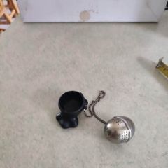 Tea Strainer, Novelty Funny On Chain with small holder.