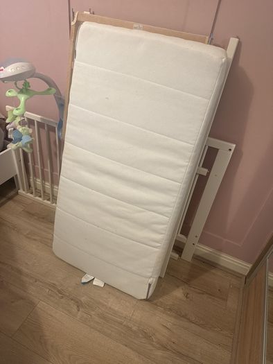 white cot with mattress
