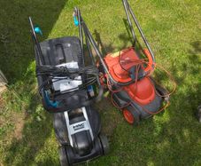 2 lawn mowers (need work)
