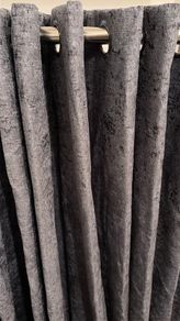 Grey curtains with extensible curtain pole